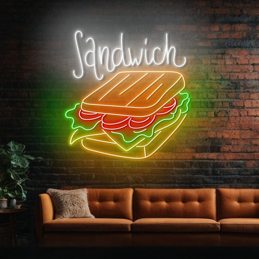 Sandwich Neon Sign | Custom Neon Sign | Neon for Restaurant Neon sign of a sandwich on a brick wall with a couch below