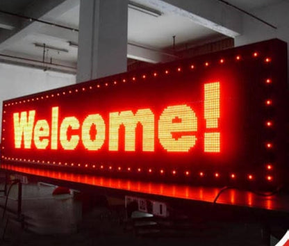 The Seven Colours Led Running Board Display Signage | LED RGB Multi Color Text Scrolling Display | Digital LED Board | Digital Signage Red LED sign with 'Welcome!' text in a warehouse setting