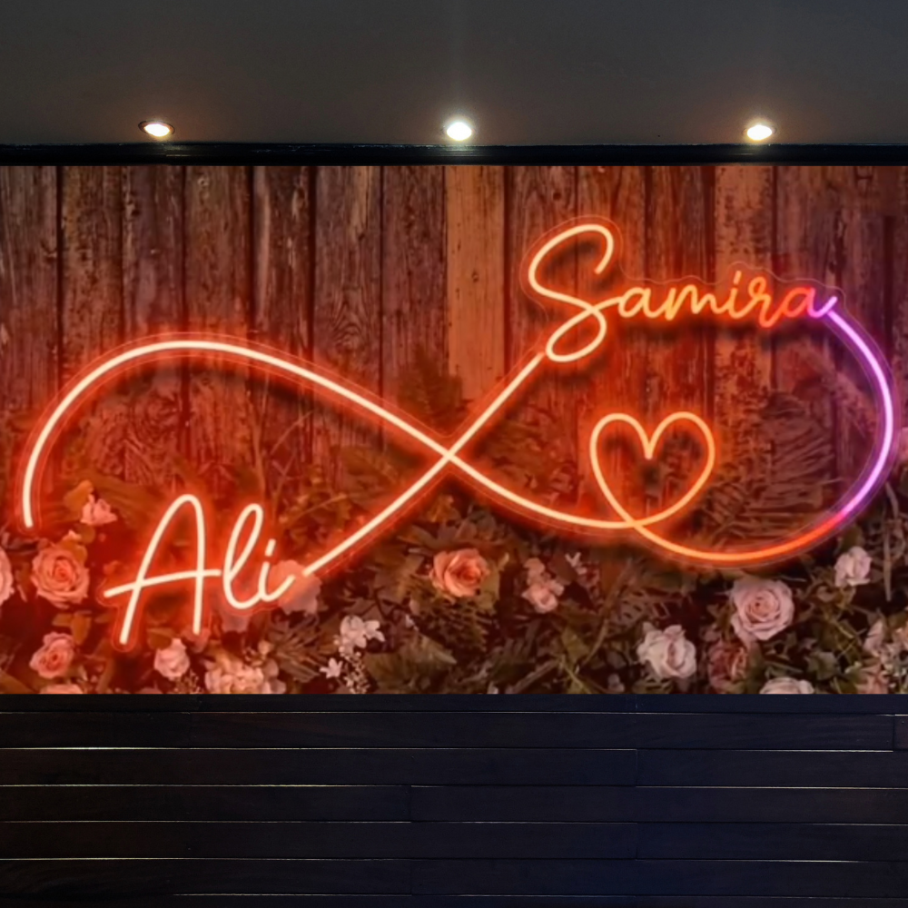  The seven Colours Couples Neon Light Names Floro Neon Light Muticolour  RGB Remote Control | Couples Names Neon Light for Weddings Neon sign with 'Samira & Ali' on a wooden background with flowers