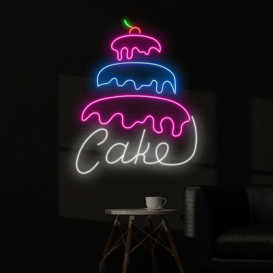 Three Layer Cake Neon Sign – Custom Neon Sign for Living Room Neon sign of a layered cake with 'Cake' text on a dark background