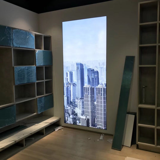 Tall backlit fabric light box panel used as an illuminated wall display in a contemporary interior