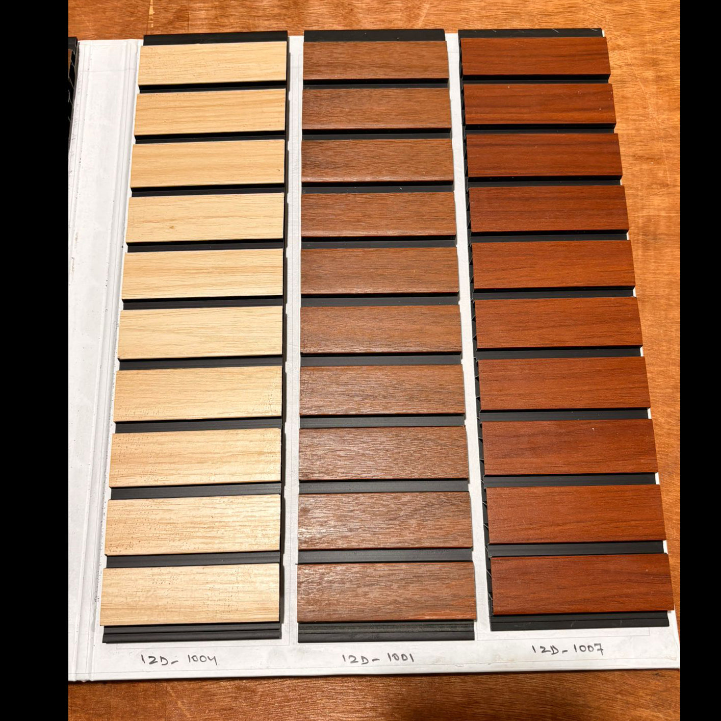 WPC Wall Panel | WPC Fluted Wall Panel PVC Louvers for Wall Decors | WPC Wall Panel Louvers (size - 12 x 120 Inches each Panel) Wooden deck board samples on a white card with measurements