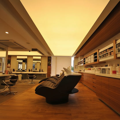 Long warm white LED fabric ceiling panel providing soft illumination in a premium beauty salon interior