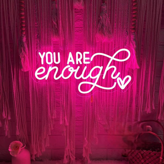 Your are Enough Neon Sign | Custom Neon Sign | Neon for Cafe Decor Neon sign with 'You are enough' text in a room with pink string lights and decor.