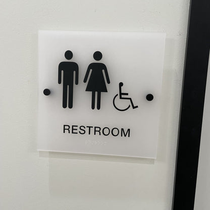 Acrylic restroom sign with men women and wheelchair icon with braille
