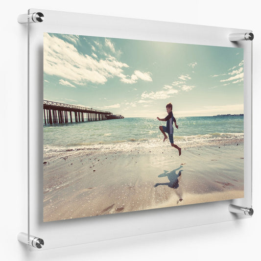 Acrylic photo frame with standoff mount and frameless glass look for wall display.
