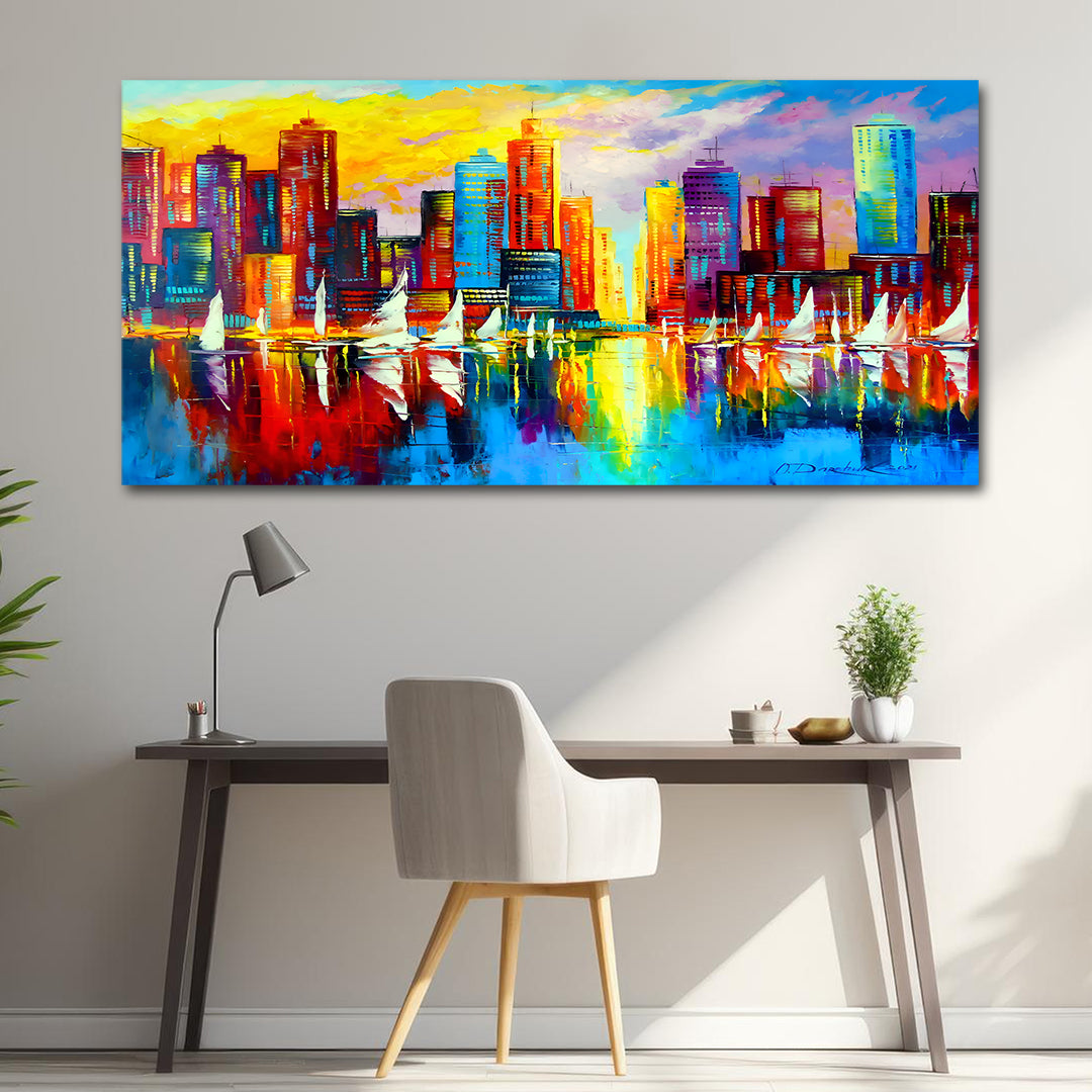 anvas Painting Wall Frame | Vibrant Impressionist Cityscape with Sailboats | Colorful Urban Skyline Reflection Big Large Size Painting (48x24 Inches) Colorful cityscape painting on a wall above a desk with a chair.