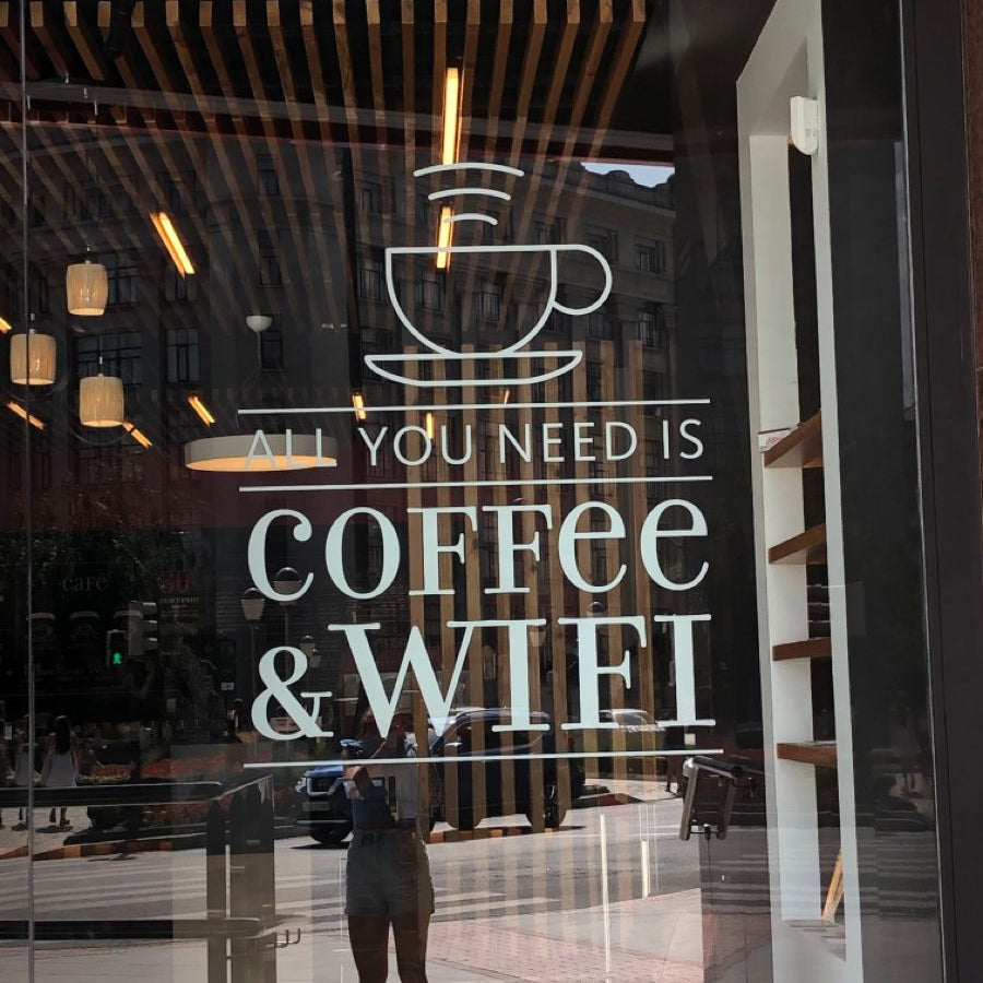 Coffee and WiFi vinyl glass sticker for cafe window branding with coffee cup graphic