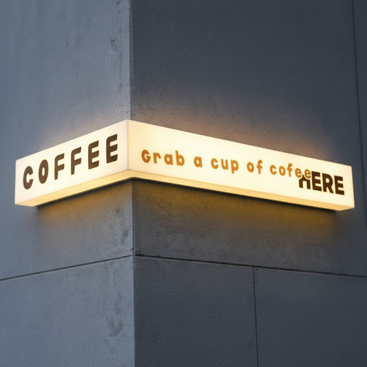 Corner mounted coffee shop light box sign with custom LED cafe branding.