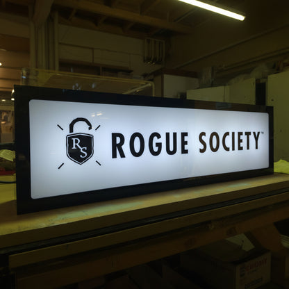 Custom LED business light box sign with illuminated storefront logo branding.