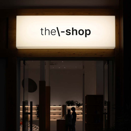 Custom retail store LED light box sign for illuminated boutique storefront branding.