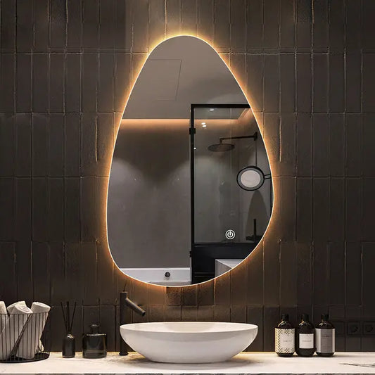 designer irregular LED bathroom mirror with warm backlight organic shape modern vanity setup