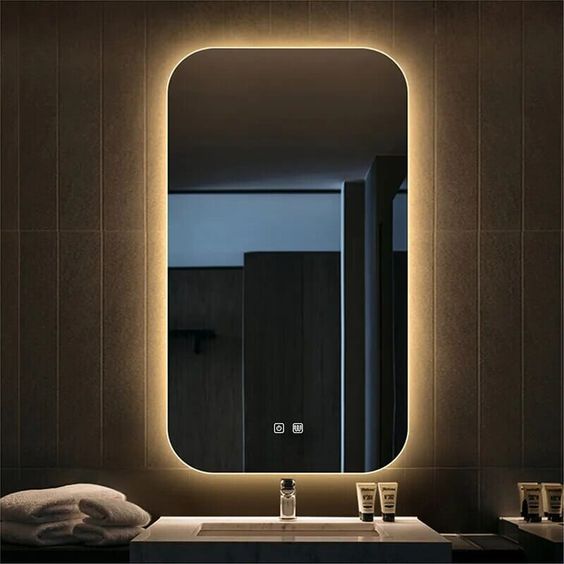 designer round LED wall mirror with ambient backlight and small ring light detail modern décor