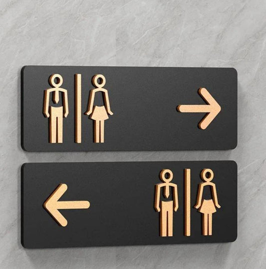 Directional restroom signage with left and right arrows and male female icons
