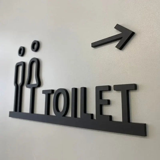 Modern directional toilet sign with arrow and restroom icons
