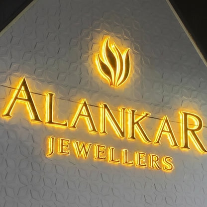 gold backlit metal letter signage with halo lighting for luxury building exterior display