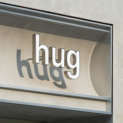 hug 3D acrylic letter sign outdoor non illuminated storefront signage shadow effect branding