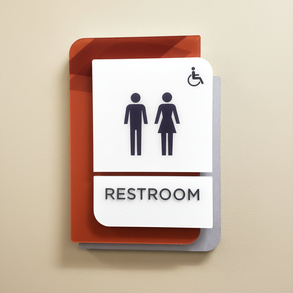 Layered acrylic restroom sign with men women and wheelchair icon
