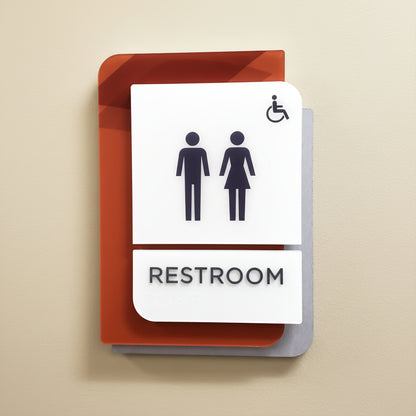 Layered acrylic restroom sign with men women and wheelchair icon
