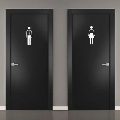 Male female restroom door icons signage on black doors for washroom identification
