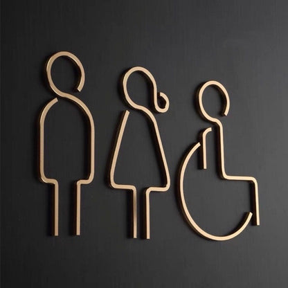 Modern accessible restroom sign with male female and wheelchair icons in gold finish
