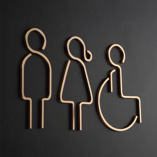 Modern accessible restroom sign with male female and wheelchair icons in gold finish
