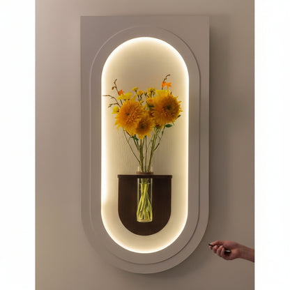 modern LED arch wall panel with glowing light and flower vase decor
