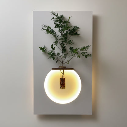 modern LED orb wall decor with glowing circle and plant vase
