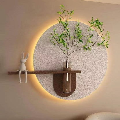 modern LED round wall decor with wooden shelf and plant vase
