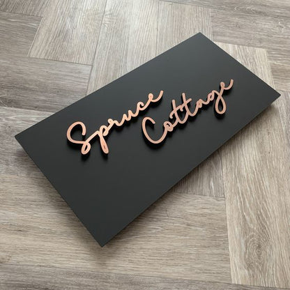 modern matte black acrylic name plate with rose gold 3d script letters custom house sign