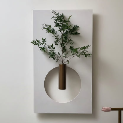 modern circle cut wall panel with shelf and glass vase plant decor
