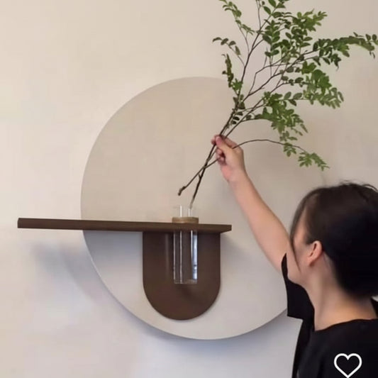 modern round wall decor with wooden shelf and glass vase holder
