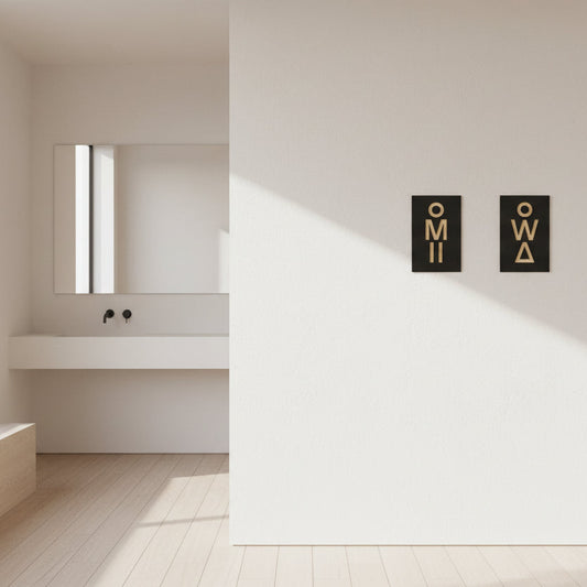 Modern OMI OWA restroom sign set in black and gold finish
