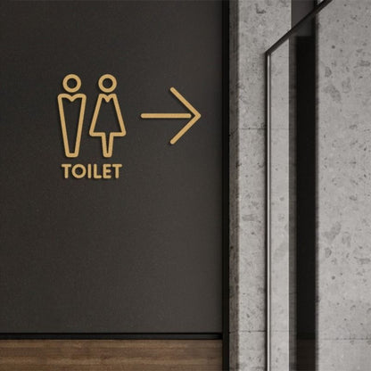 Modern toilet direction sign with male female icons and arrow in gold finish
