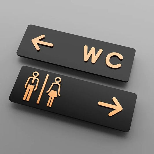 Modern WC directional restroom sign set with arrows and men women washroom symbols.