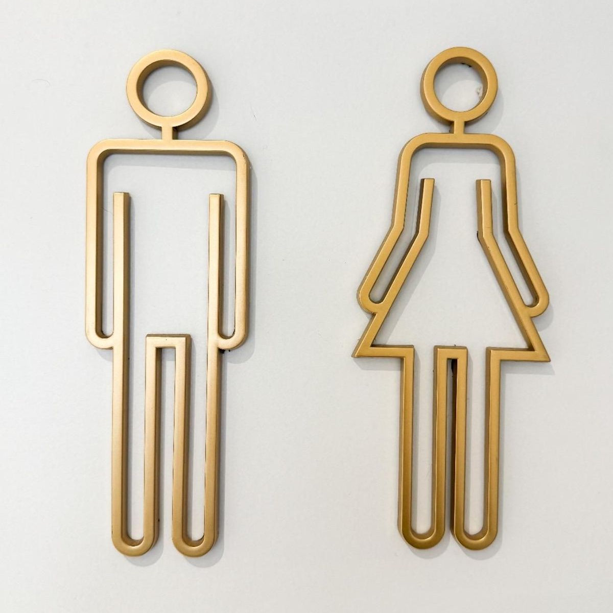 Gold metal male female restroom icons for luxury washroom signage
