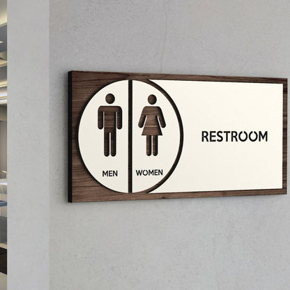 Wooden restroom sign board with men women icons and text for commercial spaces
