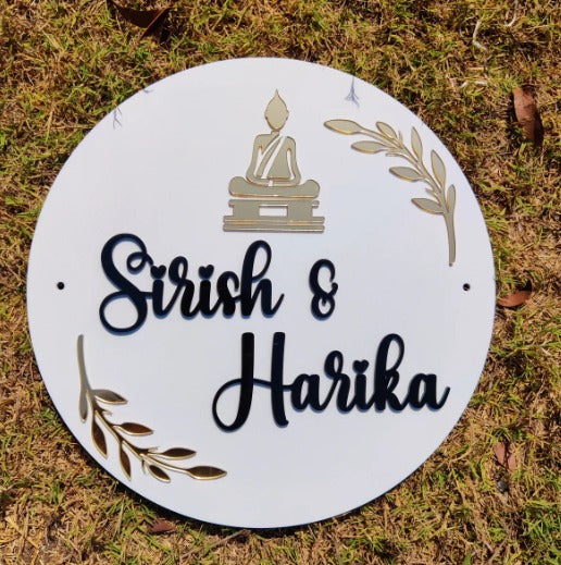 round acrylic couple name plate with buddha design and gold leaf accents personalized home signage