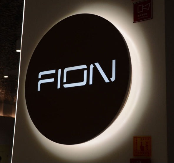 round acrylic LED backlit name sign with halo lighting for home and business branding