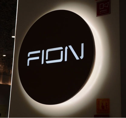 round acrylic LED backlit name sign with halo lighting for home and business branding