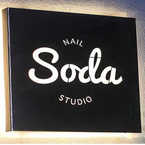 round black acrylic LED backlit restaurant sign with halo lighting for cafe and bar branding